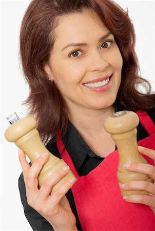 scheme - Portrait of a mid adult woman holding two pepper shakers Stock Photo - Premium Royalty-Free, Code: 625-01097604