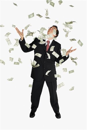 simsearch:625-01095402,k - American dollar bills raining down on a businessman Foto de stock - Sin royalties Premium, Código: 625-01097815