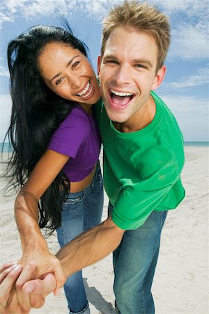 simsearch:625-01092421,k - Portrait of a young couple dancing on the beach Stock Photo - Premium Royalty-Free, Code: 625-01098037
