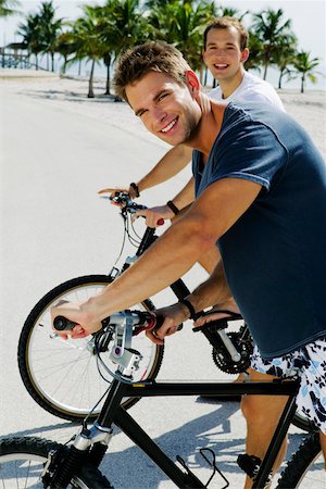 simsearch:625-01095436,k - Portrait of two young men on bicycles Stock Photo - Premium Royalty-Free, Code: 625-01098048