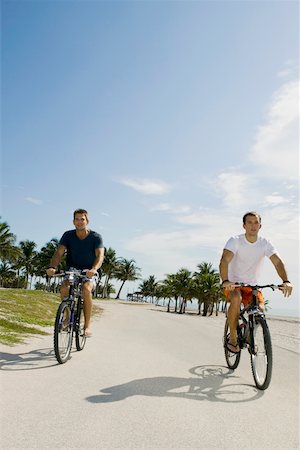 simsearch:625-01095436,k - Two young men cycling on the road Stock Photo - Premium Royalty-Free, Code: 625-01098126