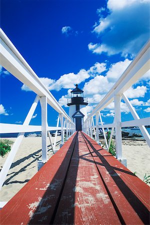 Boardwalk leading to a lighthouse Cape Cod, Massachusetts, USA Stock Photo - Premium Royalty-Free, Code: 625-01098244