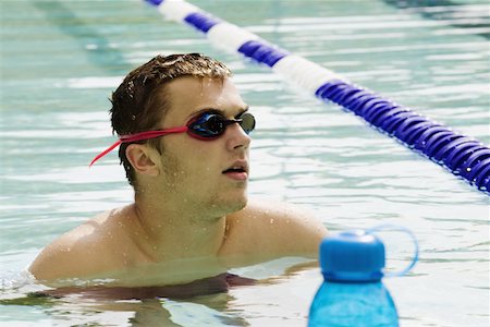 simsearch:625-01038259,k - Close-up of a young man in a swimming pool Stock Photo - Premium Royalty-Free, Code: 625-01092014