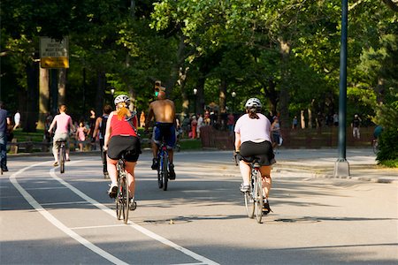 simsearch:625-01095436,k - Rear view of a group of people cycling Stock Photo - Premium Royalty-Free, Code: 625-01092022