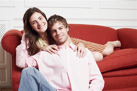 simsearch:640-01356582,k - Portrait of a young woman leaning over a young man from behind Stock Photo - Premium Royalty-Free, Code: 625-01092566