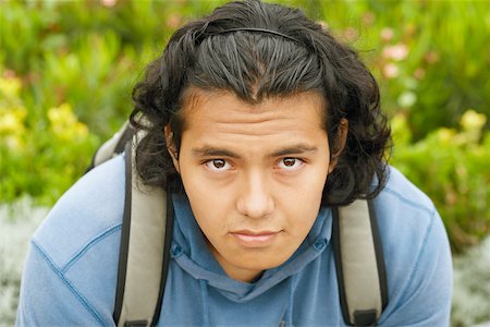 Portrait of a young man carrying a backpack Stock Photo - Premium Royalty-Free, Code: 625-01092850