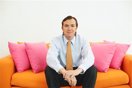 simsearch:625-01096766,k - Portrait of a businessman sitting on a couch Stock Photo - Premium Royalty-Free, Code: 625-01093041