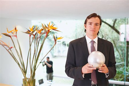 simsearch:625-01096766,k - Portrait of a businessman holding a crystal ball Stock Photo - Premium Royalty-Free, Code: 625-01093135