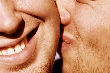 Close-up of a man kissing another man Stock Photo - Premium Royalty-Free, Code: 625-01093319