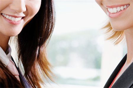 simsearch:625-00850993,k - Close-up of two businesswomen smiling Stock Photo - Premium Royalty-Free, Code: 625-01093622
