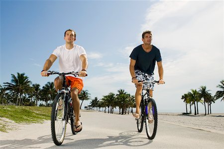 simsearch:625-01095436,k - Two young men cycling on the road Stock Photo - Premium Royalty-Free, Code: 625-01093897
