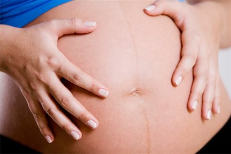 simsearch:859-03600091,k - Mitte Schnittansicht einer schwangeren Frau zu ihrem Unterleib berühren Stockbilder - Premium RF Lizenzfrei, Bildnummer: 625-01249870