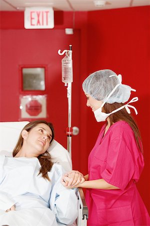 doctor patient bed side view - Female doctor consoling a female patient Stock Photo - Premium Royalty-Free, Code: 625-01250142