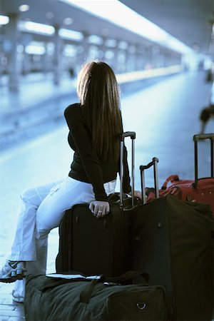 suitcase for italy - Rear view of a woman waiting at a railroad station platform, Rome, Italy Stock Photo - Premium Royalty-Free, Code: 625-01250301