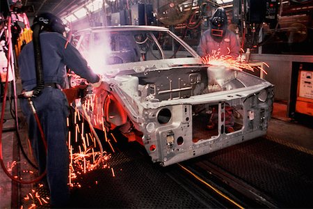 Workers weld car bodies, Chrysler plant, Newark, Delaware Foto de stock - Sin royalties Premium, Código: 625-01250342