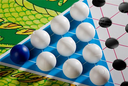 Close-up of a Chinese checkers board Stock Photo - Premium Royalty-Free, Code: 625-01250364