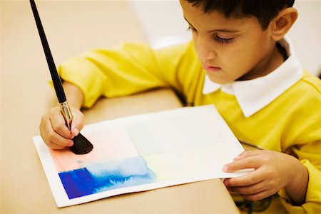 High angle view of a boy painting Stock Photo - Premium Royalty-Free, Code: 625-01250553