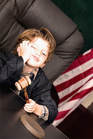 Boy imitating a judge Stock Photo - Premium Royalty-Free, Code: 625-01250851