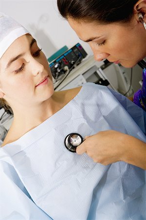 simsearch:625-01252179,k - Close-up of a female doctor examining a female patient with a stethoscope Stock Photo - Premium Royalty-Free, Code: 625-01250994