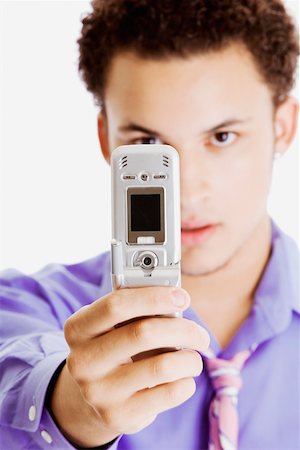 simsearch:625-02266709,k - Close-up of a businessman taking a picture of himself Foto de stock - Sin royalties Premium, Código: 625-01251048