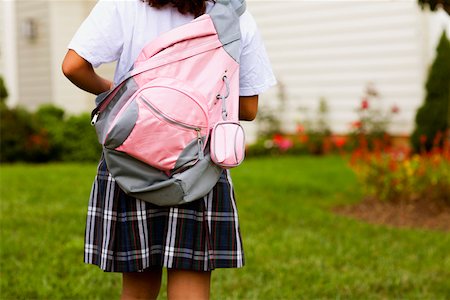 simsearch:625-01249782,k - Rear view of a schoolgirl carrying a schoolbag Fotografie stock - Premium Royalty-Free, Codice: 625-01251084