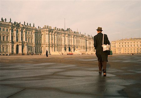 russian hermitage - Rear view of a man walking in front of a palace, Winter Palace, Hermitage Museum, St. Petersburg, Russia Stock Photo - Premium Royalty-Free, Code: 625-01251337