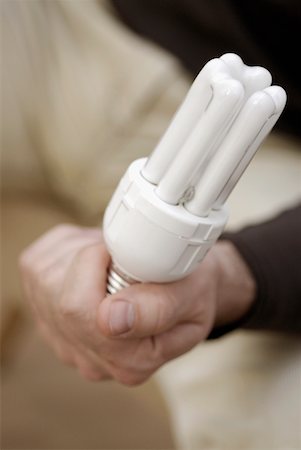 Close-up of a person's hand holding a fluorescent light Foto de stock - Royalty Free Premium, Número: 625-01251341