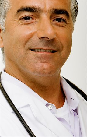 simsearch:625-02929220,k - Portrait of a male doctor with a stethoscope around his neck Stock Photo - Premium Royalty-Free, Code: 625-01251497
