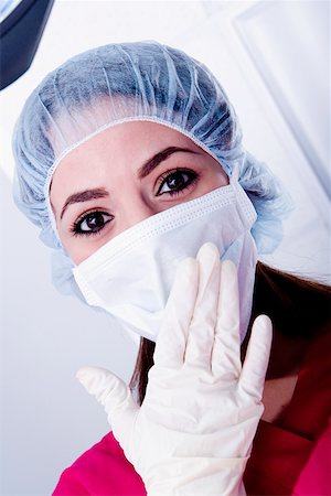 female doctor glove women only - Portrait of a female surgeon wearing scrubs Stock Photo - Premium Royalty-Free, Code: 625-01251779