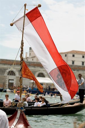 simsearch:625-01750740,k - Close-up of a flag on a gondola with a group of people behind in another gondola, Venice, Veneto, Italy Stock Photo - Premium Royalty-Free, Code: 625-01251858