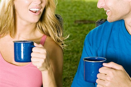 Mid section view of a young couple holding coffee cups Stock Photo - Premium Royalty-Free, Code: 625-01251924