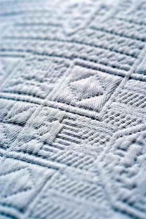 embossed seal - Close-up of an embossed design on fabric Stock Photo - Premium Royalty-Free, Code: 625-01252089