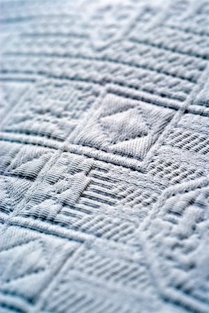 Close-up of an embossed design on fabric Fotografie stock - Premium Royalty-Free, Codice: 625-01252089