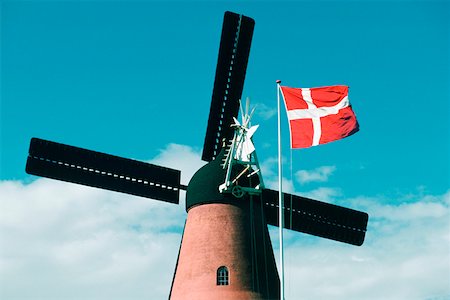 denmark environmental problems - Low angle view of a windmill and the Danish flag, Funen County, Denmark Stock Photo - Premium Royalty-Free, Code: 625-01252245