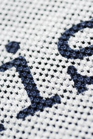 Close-up of letters on a woolen fabric Foto de stock - Sin royalties Premium, Código: 625-01252384