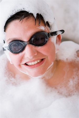 Close-up of a boy in a bubble bath Stock Photo - Premium Royalty-Free, Code: 625-01264080