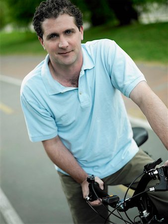 simsearch:625-01095436,k - Portrait of a mid adult man on a bicycle Stock Photo - Premium Royalty-Free, Code: 625-01264168