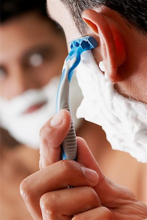 espuma de afeitar - Close-up of a young man shaving Foto de stock - Sin royalties Premium, Código: 625-01264247