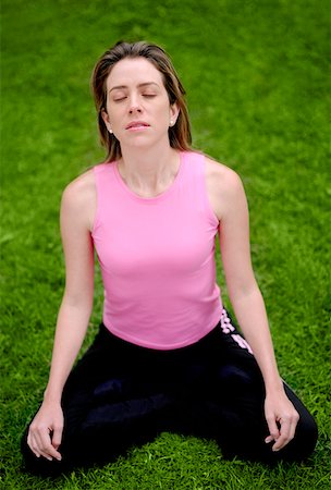 simsearch:630-03479808,k - High angle view of a young woman sitting in the lotus position Fotografie stock - Premium Royalty-Free, Codice: 625-01264438