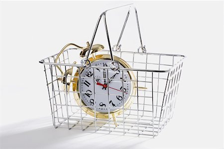 Close-up of an alarm clock in a basket Stock Photo - Premium Royalty-Free, Code: 625-01264819