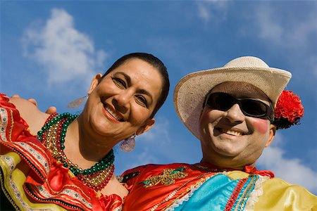 Low angle view of a mature couple wearing costumes and smiling Stock Photo - Premium Royalty-Free, Code: 625-01264957