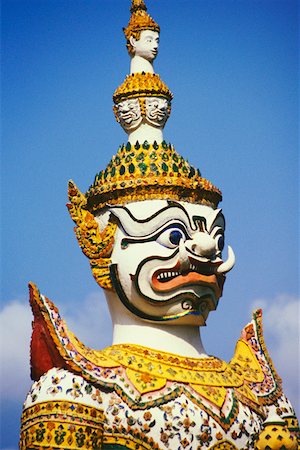 Close-up of a statue of demon, Wat Arun, Bangkok, Thailand Stock Photo - Premium Royalty-Free, Code: 625-01265158