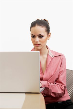 student latino business casual - Close-up of a businesswoman using a laptop Stock Photo - Premium Royalty-Free, Code: 625-01260626