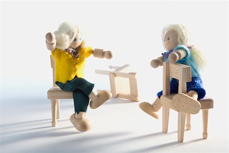 doll white background - Two dolls sitting on chairs Stock Photo - Premium Royalty-Free, Code: 625-01261205
