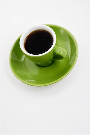High angle view of a cup of black tea on a saucer Foto de stock - Sin royalties Premium, Código: 625-01261234