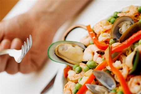 rice pan - Close-up of seafood with rice and green peas in a pan Stock Photo - Premium Royalty-Free, Code: 625-01261262