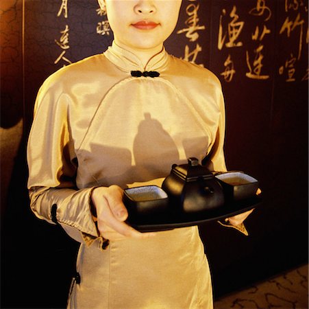 Waitress holding a serving tray, Shanghai, China Stock Photo - Premium Royalty-Free, Code: 625-01261466