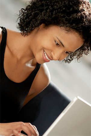 simsearch:625-01097322,k - Close-up of a young woman using a laptop Stock Photo - Premium Royalty-Free, Code: 625-01261504