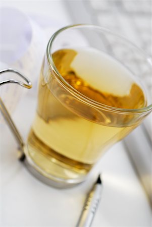 simsearch:625-01252133,k - Close-up of a cup of herbal tea with a pen Stock Photo - Premium Royalty-Free, Code: 625-01261617