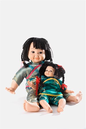 doll white background - Close-up of two dolls Stock Photo - Premium Royalty-Free, Code: 625-01261846